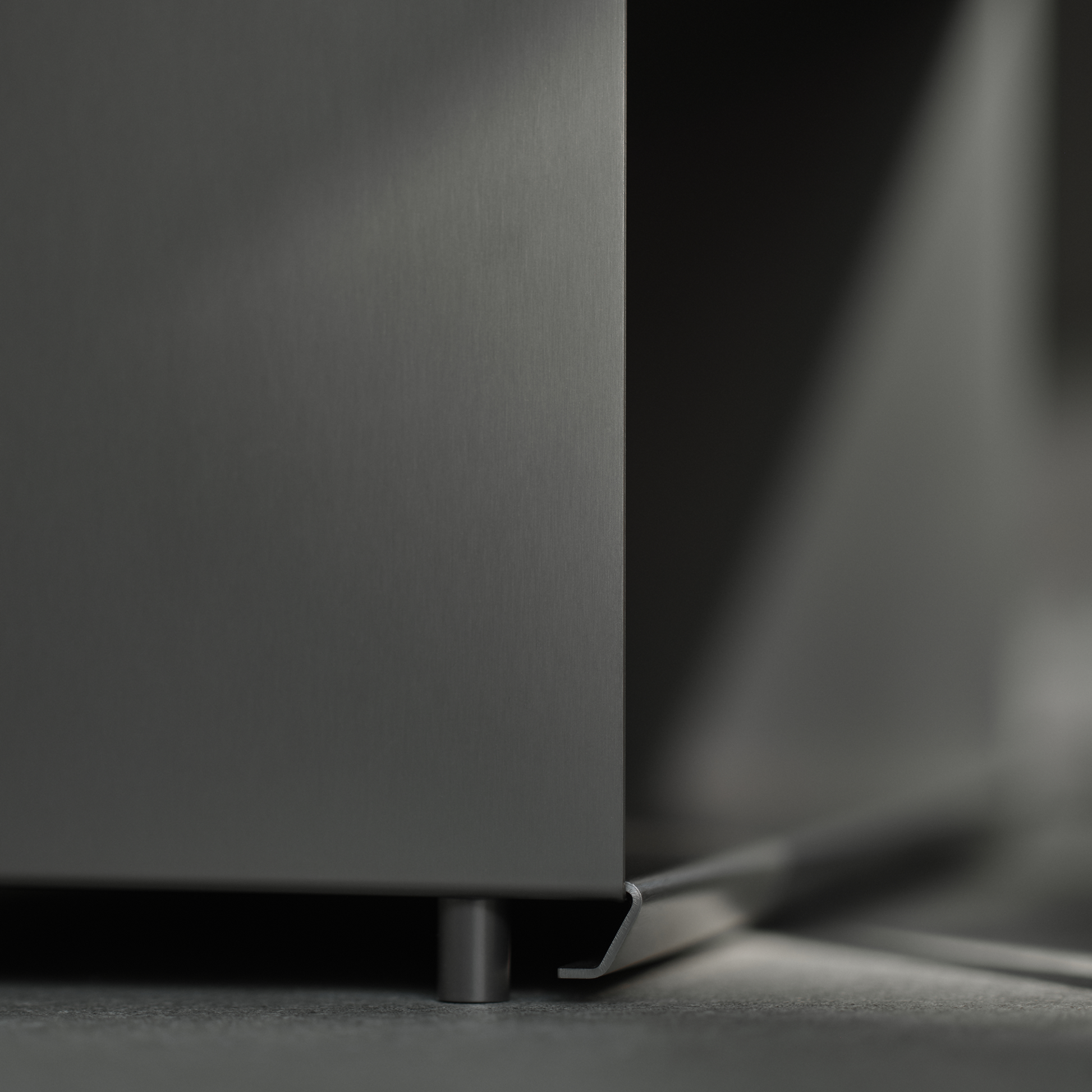 Close-up of M85 modular shelving system on a dark surface