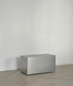 M85 aluminum shelf against a white wall on a wooden floor