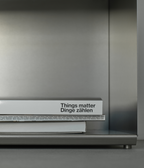 M85 gunmetal aluminum bookshelf with a book titled 'Things matter Dinge zählen' 