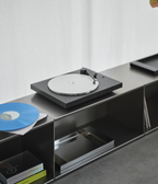 Turntable on a modern entertainment console built with M85 aluminum modular shelving system with a white background