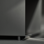 Close-up of M85 modular shelving system on a dark surface