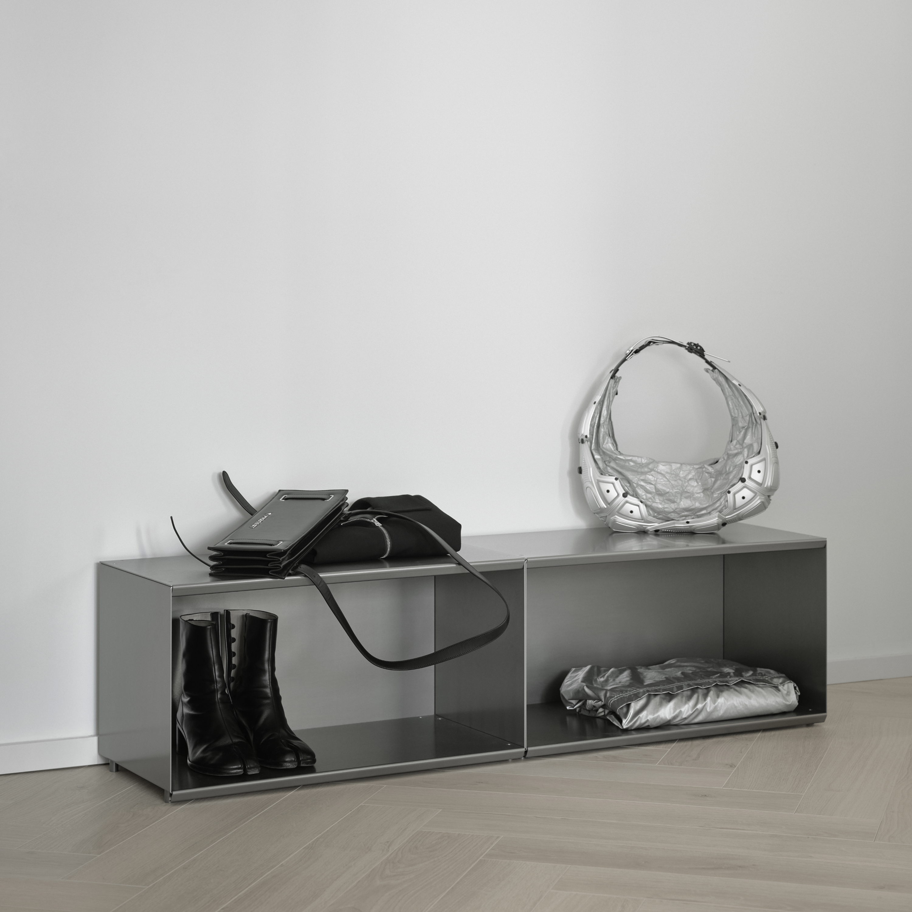 M85 gray modular shelf used as storage unit against a white wall