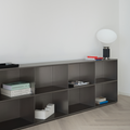 M85 Modern gunmetal grey aluminum modular bookshelf with minimal decor against a white wall
