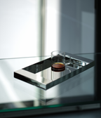 M85 stainless steel tray with mirror polish on a glass table with a coffee mug